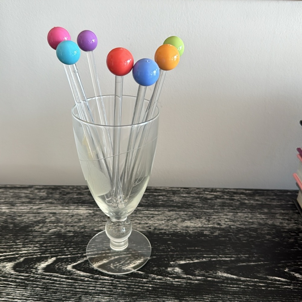 Set of 7 multi colored balloon popsicle cocktail stirrers.